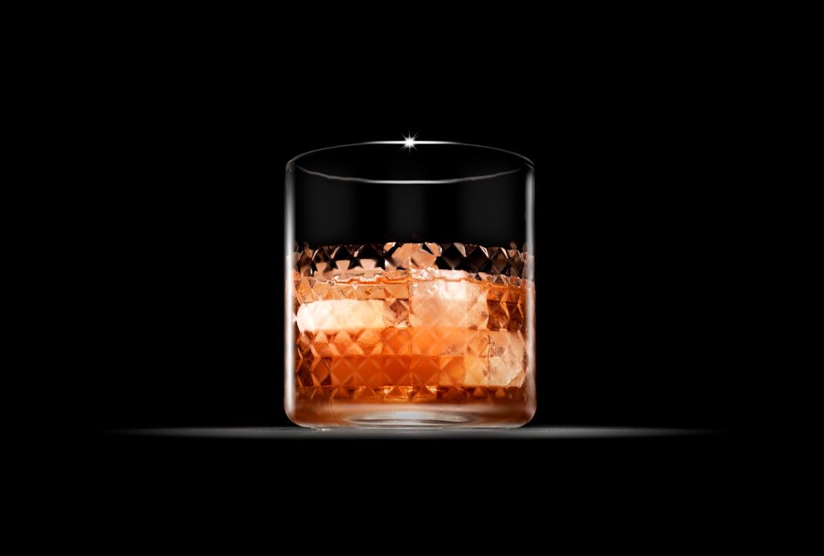 Whisky poured neat over a large ice cube