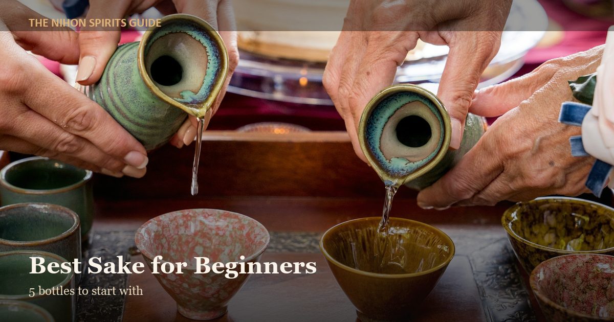 Sake being poured into ceramic cups